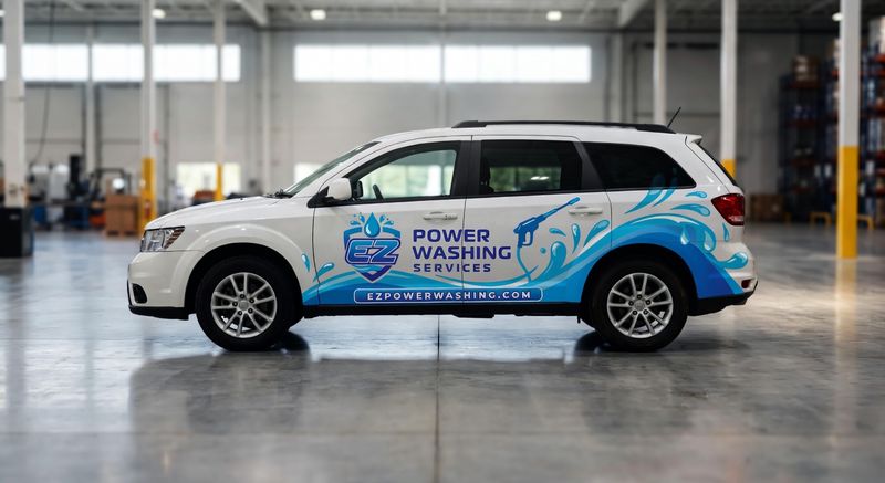 Concept mockup: white Dodge Journey SUV, side view, with a blue water-splash partial wrap on the lower doors and rear quarter, an "EZ" shield logo, "Power Washing Services" text, and a website banner.